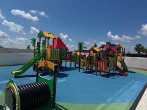 a playground with a row of colorful slides at Central Park 7 in Burgas City