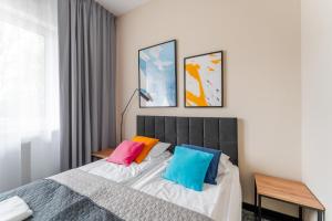 Posteľ alebo postele v izbe v ubytovaní IND.U Apartamenty + 37 fotografií