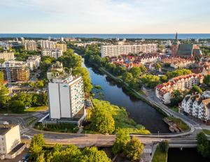 Výhľad na mesto Kołobrzeg alebo výhľad na mesto priamo z apartmánového hotela