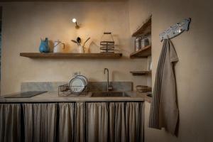 a kitchen with a sink and a counter top at L'imbrunire in Campiglia dʼOrcia +56 photos