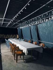 a long table and chairs with a long table and chairs at Hostel 555 by VL in Alaverdi
