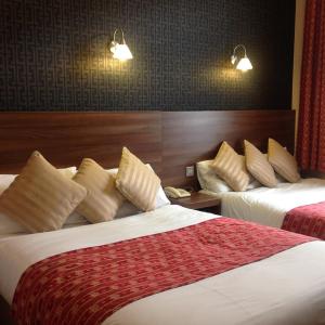 Postel nebo postele na pokoji v ubytování Oliver Hotel