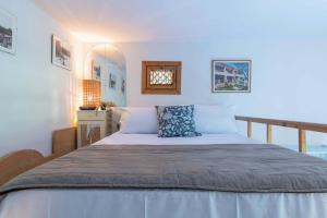 Giường trong phòng chung tại Italian Experience-Suite Vogel