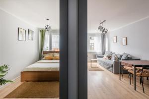 En eller flere senge i et værelse på WroStay Kuźnicza