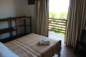 a bedroom with a bed and a large window at Apart Hotel Casa Grande in Natal +70 photos