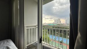 a room with a view of the pool from a balcony at Bellevue Radio Dalam in Mantaak