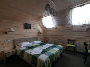 Postel nebo postele na pokoji v ubytování Шале На бе́резі
