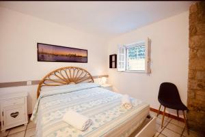 A bed or beds in a room at Villa GREG stupenda location sulla spiaggia con accesso diretto al mare