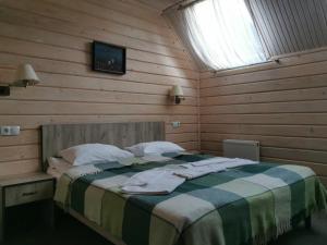 Postel nebo postele na pokoji v ubytování Шале На бе́резі