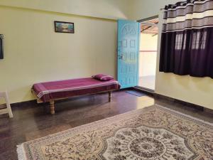 a room with a bench in a room with a door at Valley View by Green Trails in Chikmagalūr +13 photos