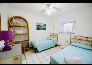 A bed or beds in a room at Villa GREG stupenda location sulla spiaggia con accesso diretto al mare