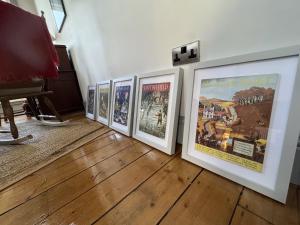 a group of framed movie posters on a wall at High Living in Carlisle