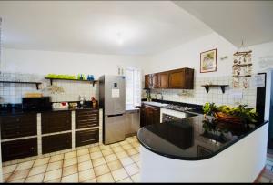 A kitchen or kitchenette at Villa GREG stupenda location sulla spiaggia con accesso diretto al mare