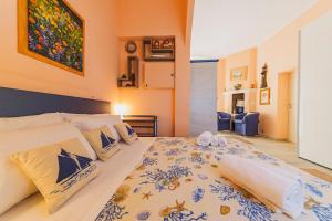 a bedroom with a large bed in a room at Casa a *POLIGNANO* con [Affaccio sul Mare] in Polignano a Mare