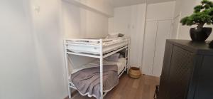 a room with a white shelf with papers on it at Evasion mer à Ostende in Ostend