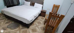 Postel nebo postele na pokoji v ubytování HoTEL RUDRA