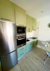 Kuchyň nebo kuchyňský kout v ubytování Green Oasis Apartment - Orlandito