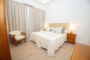 Ένα ή περισσότερα κρεβάτια σε δωμάτιο στο El Templete Suite 1