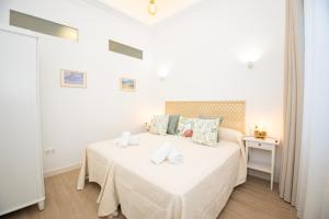 Ένα ή περισσότερα κρεβάτια σε δωμάτιο στο El Templete Suite 1