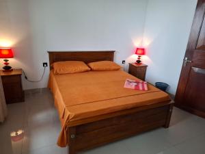 Postel nebo postele na pokoji v ubytování Kandy Grand Hill