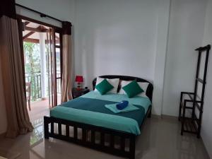 Postel nebo postele na pokoji v ubytování Kandy Grand Hill