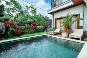Bazén v ubytování The Wahyu Villa Uluwatu nebo v jeho okolí