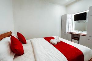 Postel nebo postele na pokoji v ubytování The Wahyu Villa Uluwatu