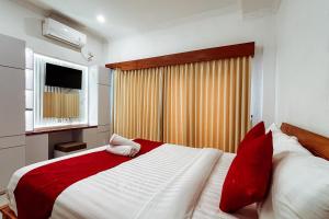 Postel nebo postele na pokoji v ubytování The Wahyu Villa Uluwatu