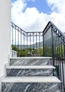 a set of stairs leading up to a balcony with a view at Villa Donna Olga in Sant'Agnello