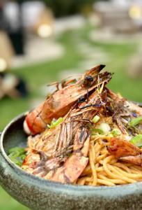 a bowl of food with shrimp and pasta at Hôtel Palombaggia in Porto-Vecchio