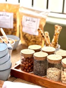 a table with jars of nuts and other ingredients at Hôtel Palombaggia in Porto-Vecchio