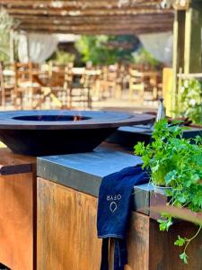 a table with two pans on top of it at Hôtel Palombaggia in Porto-Vecchio