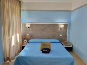 Ein Bett oder Betten in einem Zimmer der Unterkunft Hotel Monna Lisa