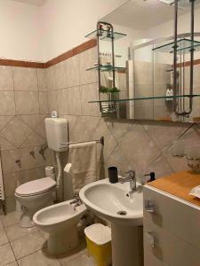 a bathroom with a toilet and a sink at Room Josip in Senj