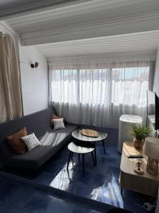 Coin salon dans l'établissement Appartement 4 personnes à 50 m de la plage