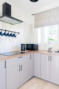 Kuchyň nebo kuchyňský kout v ubytování Willa Verano - Wyjątkowy Komfort Bardzo Blisko Plaży