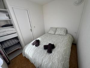 Un ou plusieurs lits dans un hébergement de l'établissement Appartement 4 personnes à 50 m de la plage
