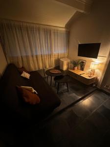 Télévision ou salle de divertissement dans l'établissement Appartement 4 personnes à 50 m de la plage