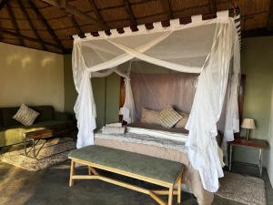 Ένα ή περισσότερα κρεβάτια σε δωμάτιο στο Livingstone's Camp