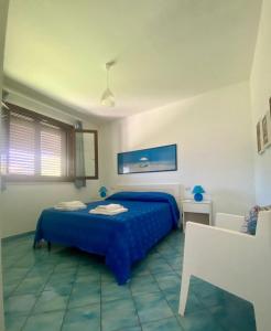 En eller flere senge i et værelse på Casa Vacanze Lido Burrone + 14 billeder