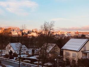 a city with snow covered roofs and houses at Das Tor zum Sauerland in Büren