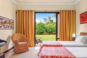 a hotel room with two beds and a large window at Villa Arcana - Exclusive stay in Mauritius by Sealodge in Tamarin +33 photos