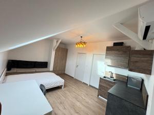 a bedroom with a bed and a tv in it at New appartement in Turckheim