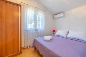Postel nebo postele na pokoji v ubytování Apartments and Room Villa Niko