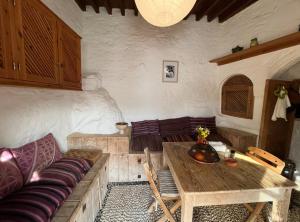 a living room with a couch and a wooden table at Villa Kali in Lindos