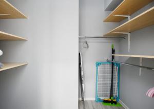 a room with a tennis racket and a rackett at Apartament Black Sunset Resort SurfingBird Grzybowo in Grzybowo