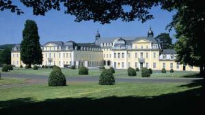 a large building with trees in front of it at Ferienwohnung Freiendiez in Diez
