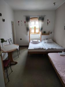 Voodi või voodid majutusasutuse PENZION "U MLÝNA" Mlýnská 678 toas