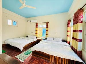 Letto o letti in una camera di Hotel Mantra and Adventure