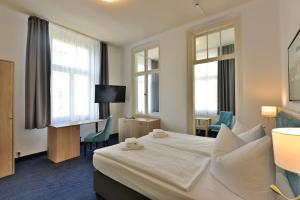 Postel nebo postele na pokoji v ubytování Hotel Meereseck
